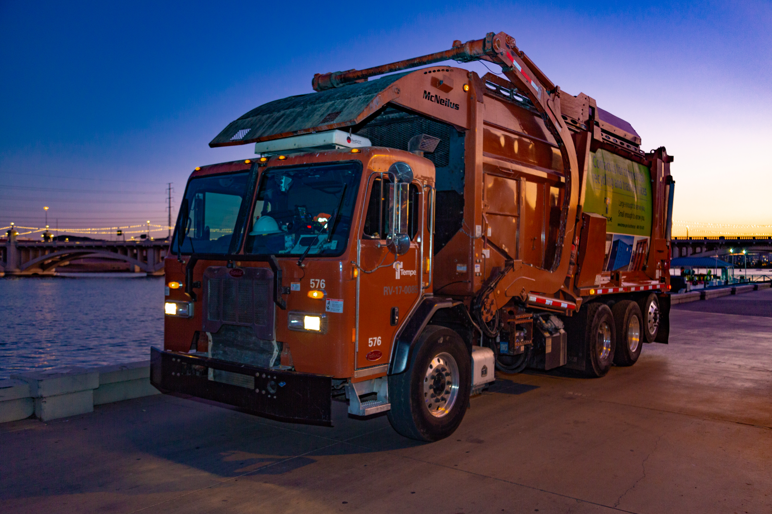 Solid waste truck at sunset