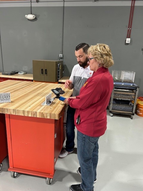 Councilmember Adams participates in welding simulation training at Sundt