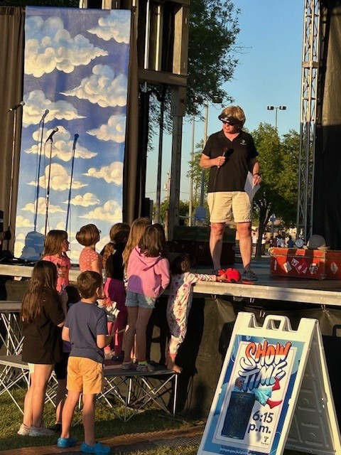 Councilmember Jennifer Adams talks to a group of Tempe kids at Arts in the Park